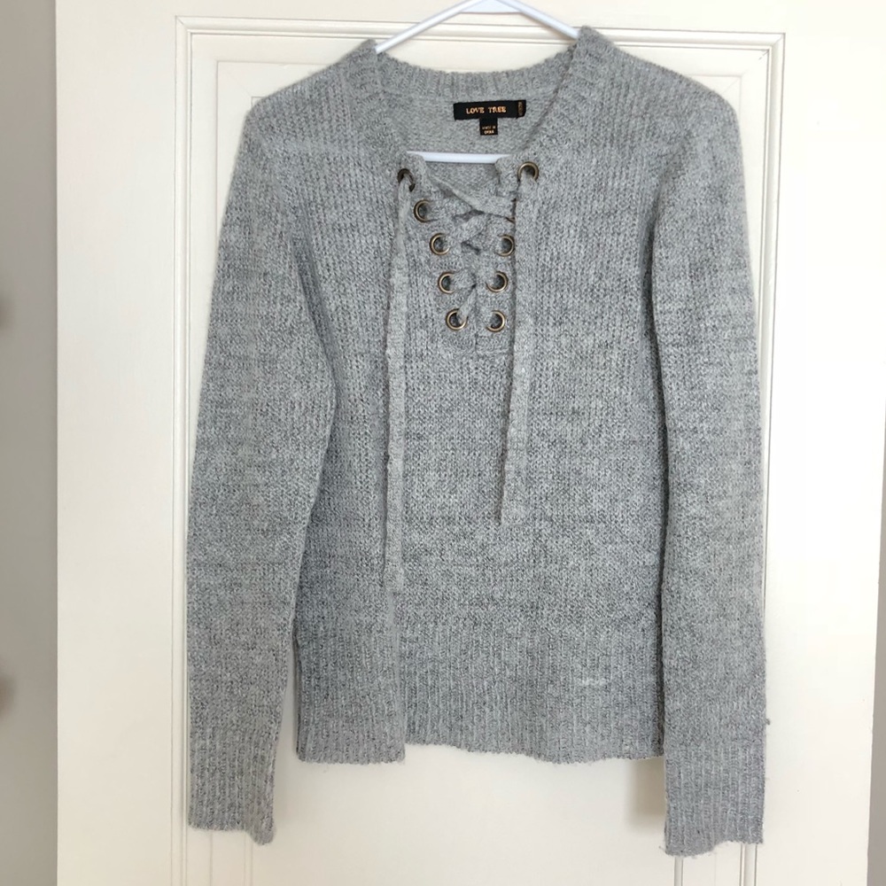 Grey knit sweater with lace up detail